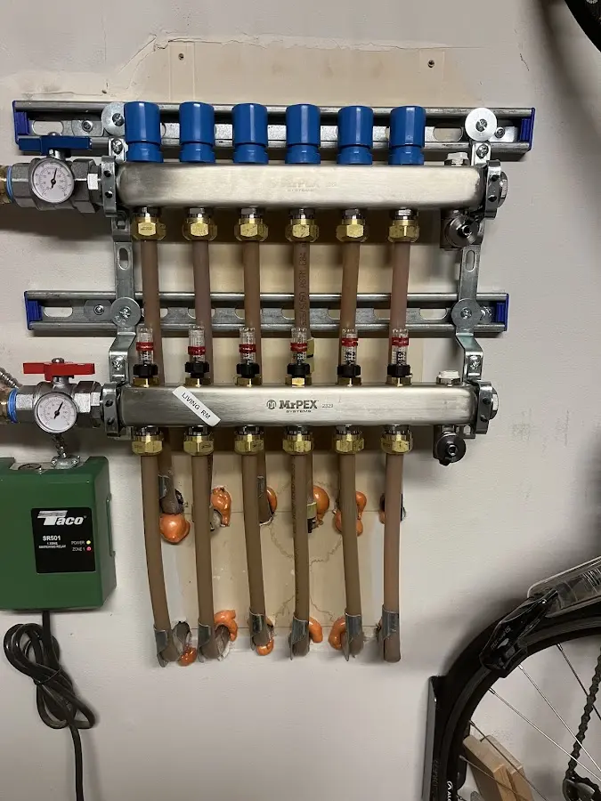 Plumber performing Water Heater Repair at a residential property in North Syracuse